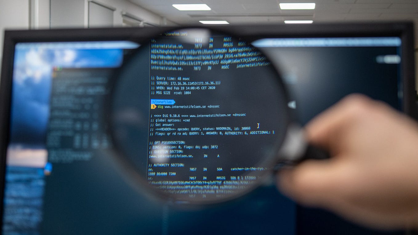 Data analysis services in Dover, New Hampshire. A magnifying glass is centered over a screen showing business intelligence. Photo by Kristina Alexanderson. CC license.